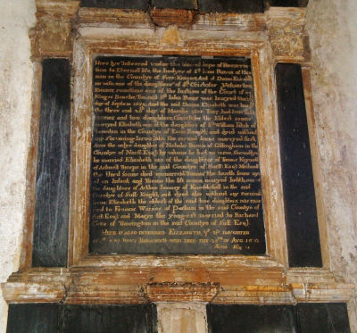 Fine wall monument with cherub beneath and coat of arms above/ to Sir John Rous (1652) and to Elizabeth/ his second daughter